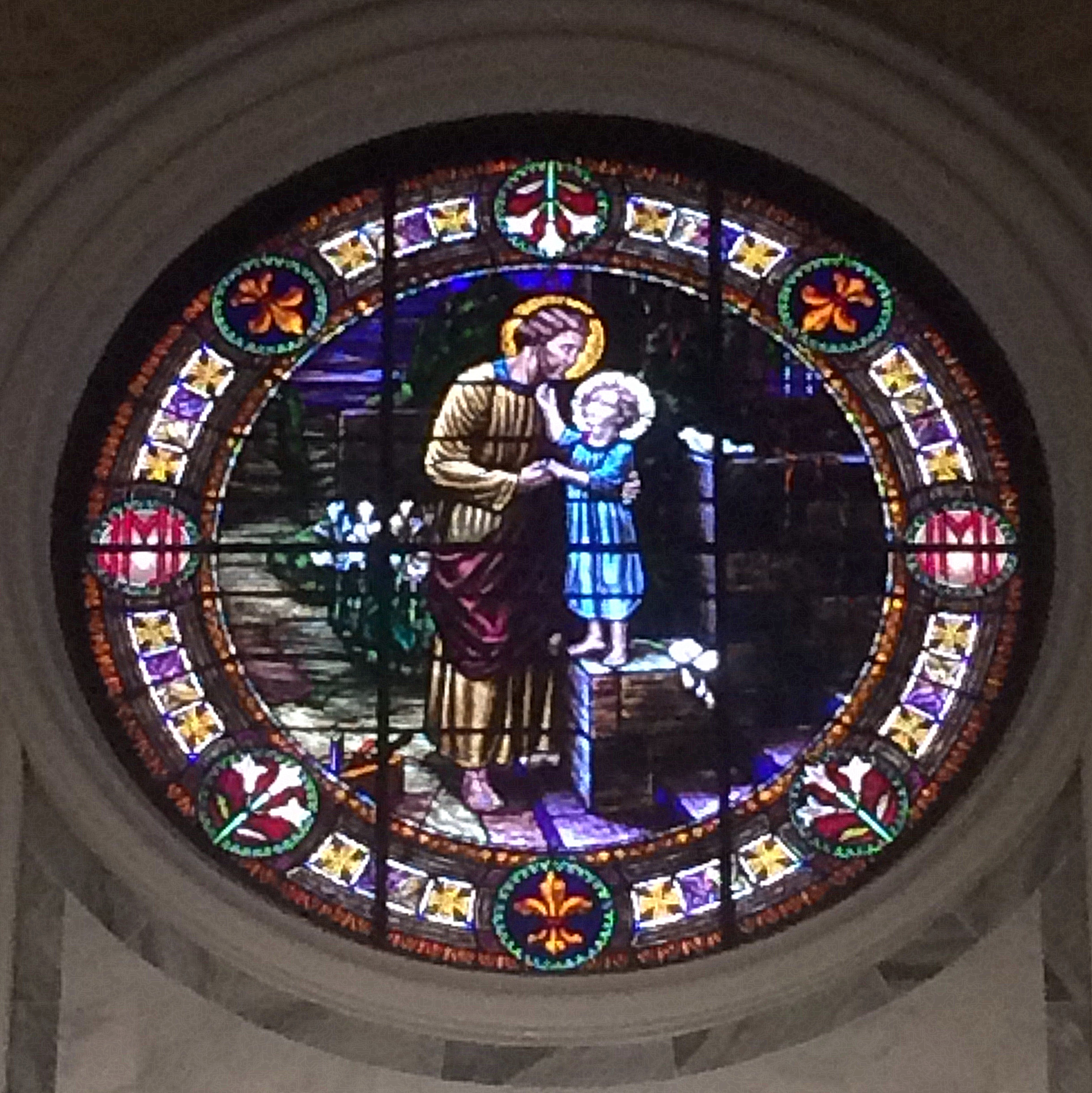 Stained glass window of Saint Joseph and the Christ Child